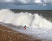 Local celebrity Wee Gordon Lambsay trying to hold back the waves!